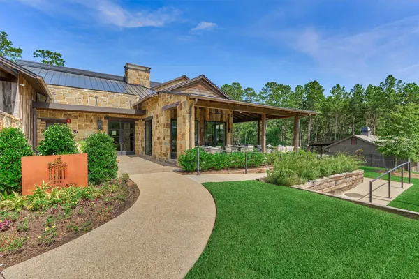 a kitchen with stainless steel appliances kitchen island granite countertop a large counter top and wooden floors