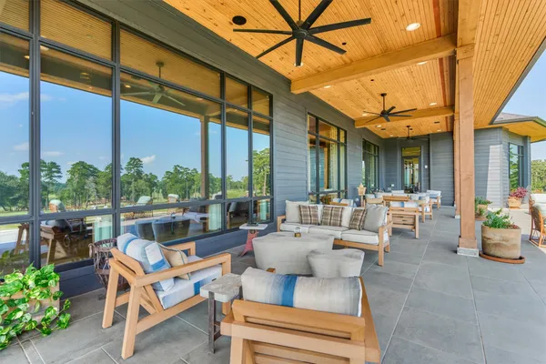 a view of swimming pool with outdoor seating