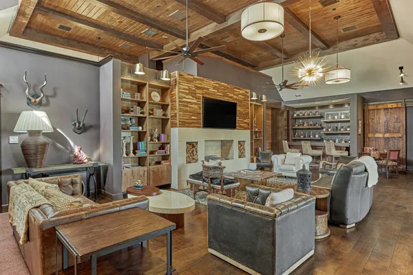 a room with lots of furniture and chandelier