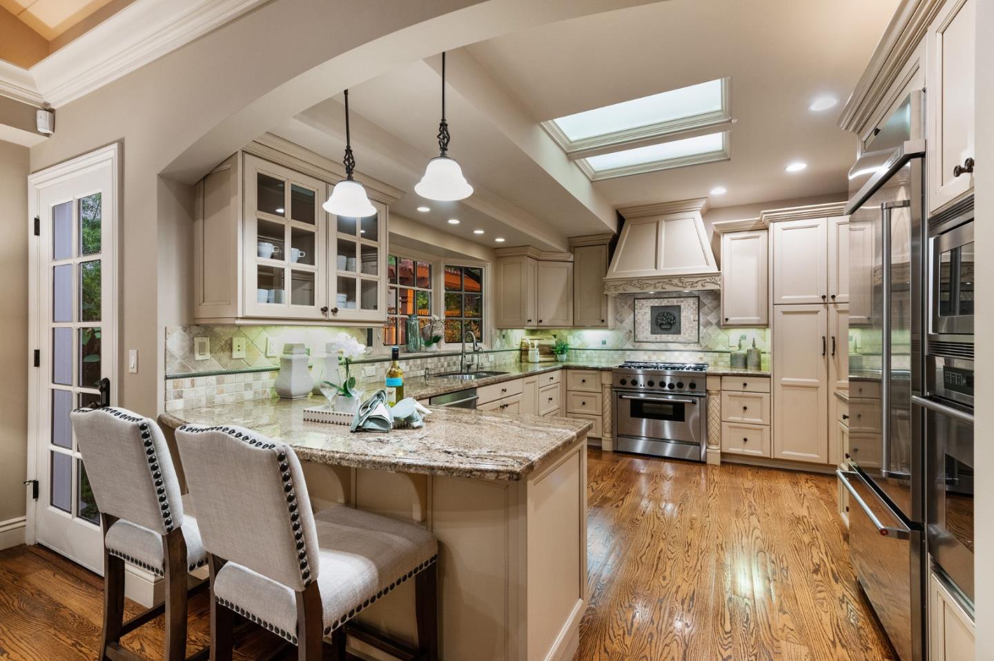 60 Holbrook Lane Atherton, CA 94027 - Photo 13 of 29 a view of a dining room with furniture and wooden floor
