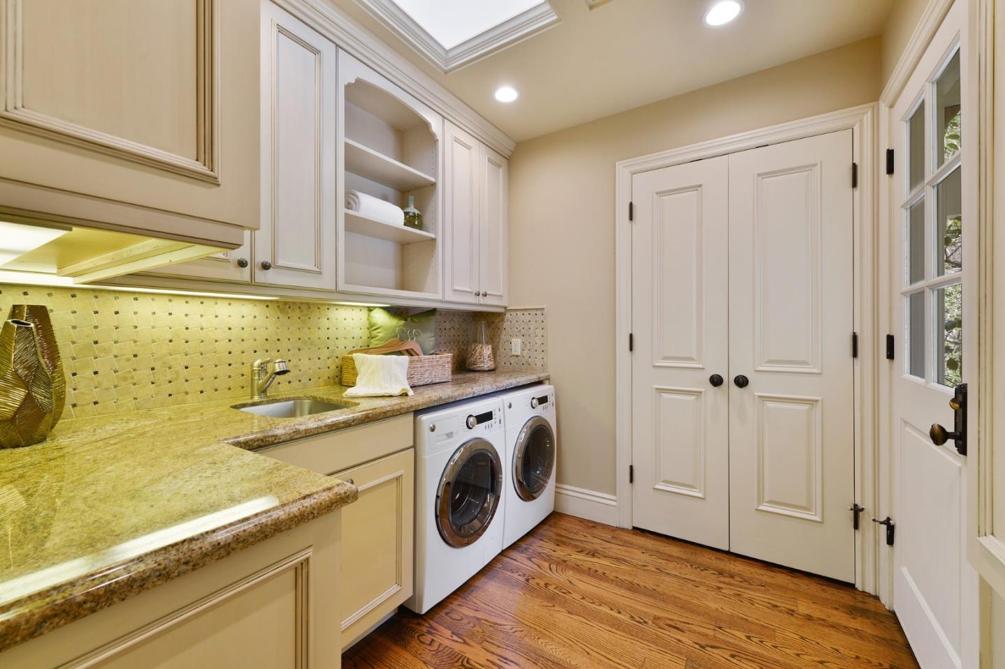 60 Holbrook Lane Atherton, CA 94027 - Photo 23 of 29 a view of a hallway with washer and dryer