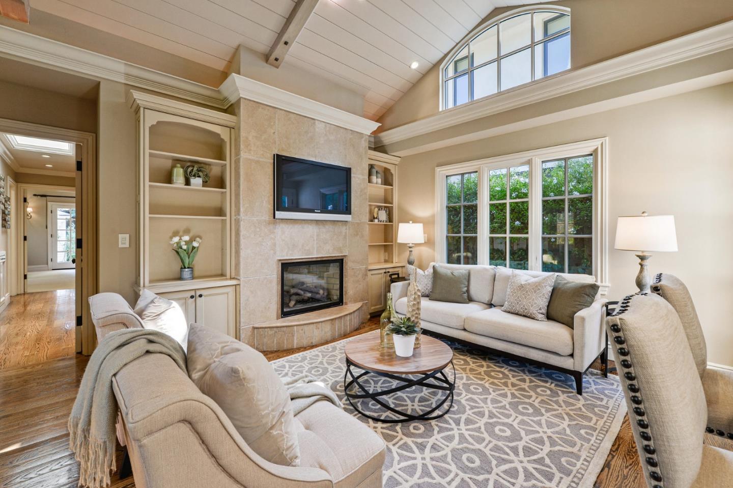 60 Holbrook Lane Atherton, CA 94027 - Photo 24 of 29 a living room with furniture fireplace and a flat screen tv