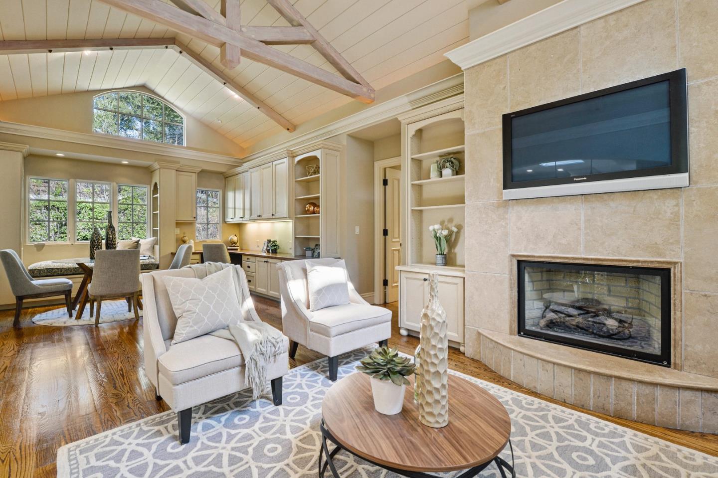 60 Holbrook Lane Atherton, CA 94027 - Photo 26 of 29 a living room with furniture a fireplace and a flat screen tv