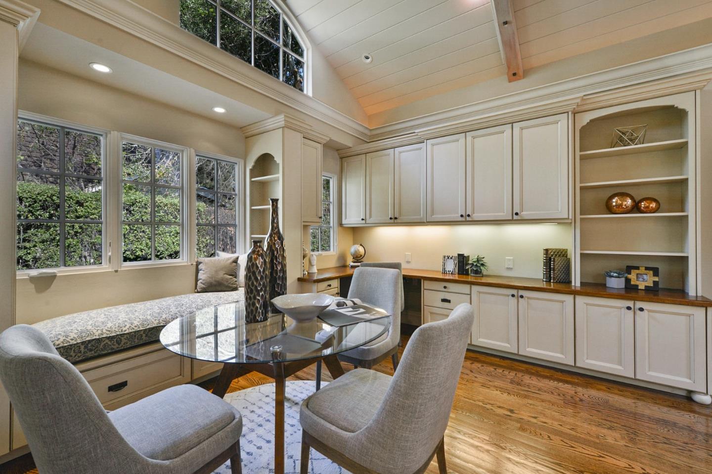60 Holbrook Lane Atherton, CA 94027 - Photo 27 of 29 a kitchen with granite countertop a dining table chairs and white cabinets
