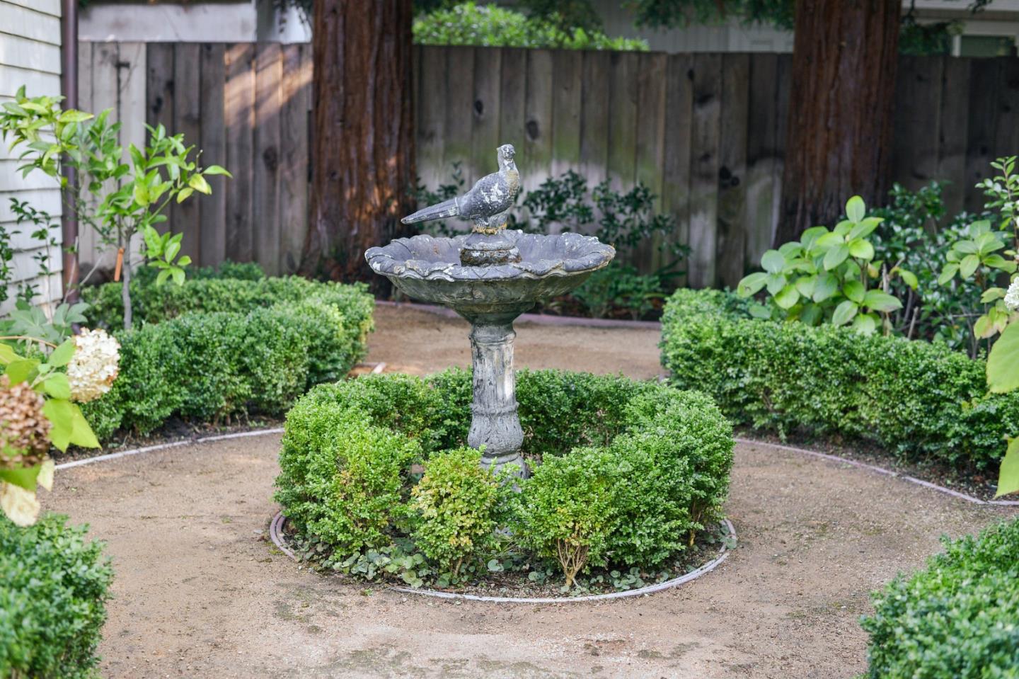 60 Holbrook Lane Atherton, CA 94027 - Photo 6 of 29 a garden with a lots of flower plants and wooden fence