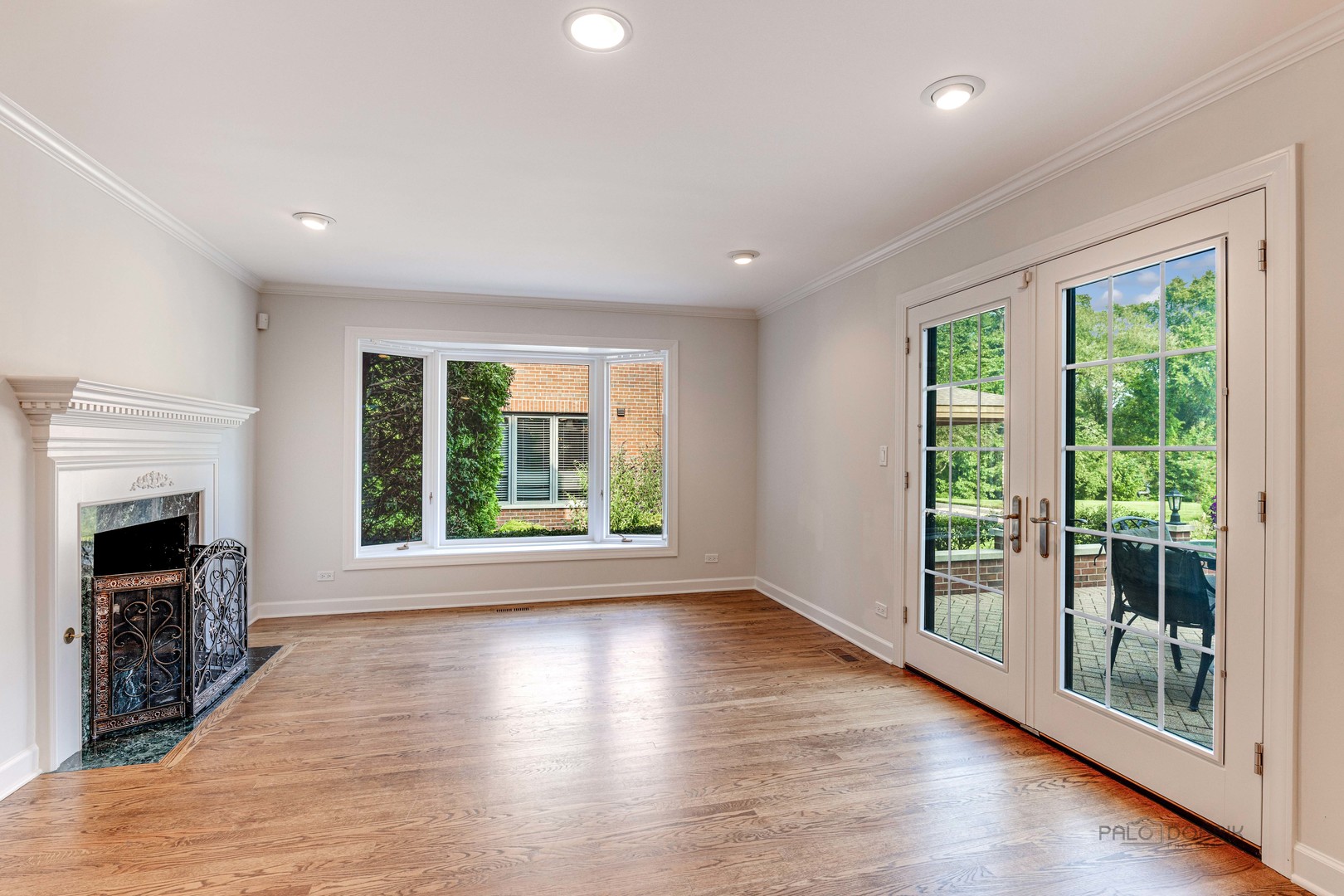 291 West Deerpath Road Lake Forest, IL 60045 - Photo 7 of 37 a view of an empty room with wooden floor and a window