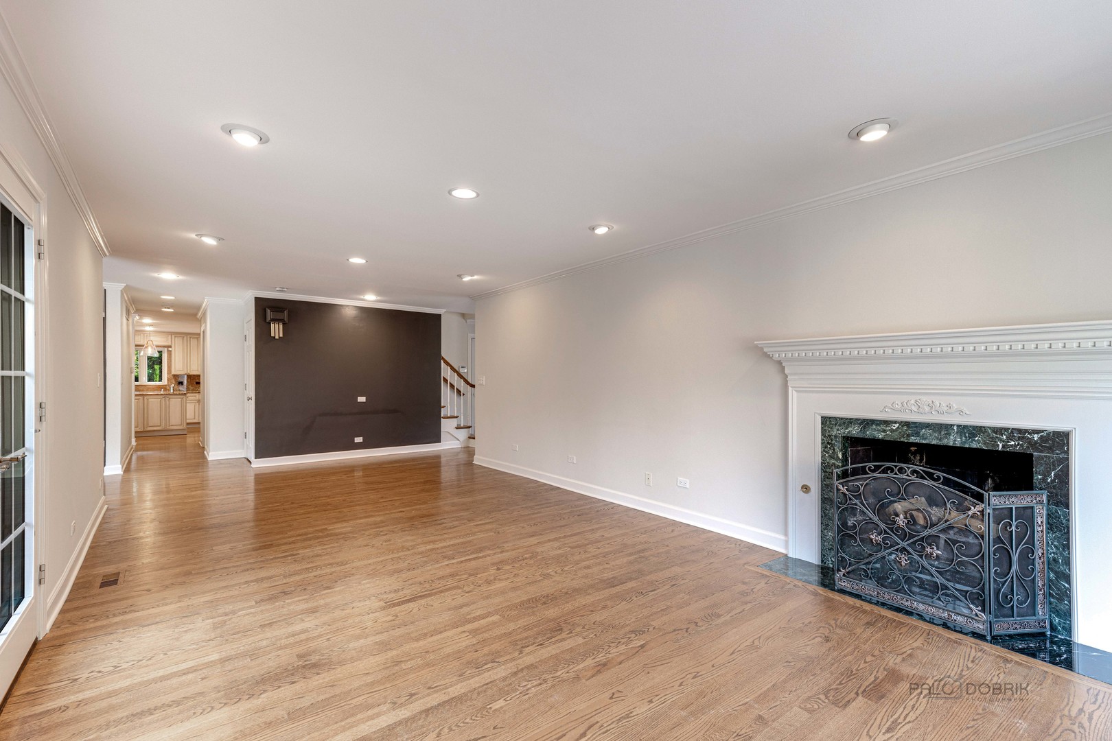 291 West Deerpath Road Lake Forest, IL 60045 - Photo 8 of 37 a view of an empty room with wooden floor fireplace and a window