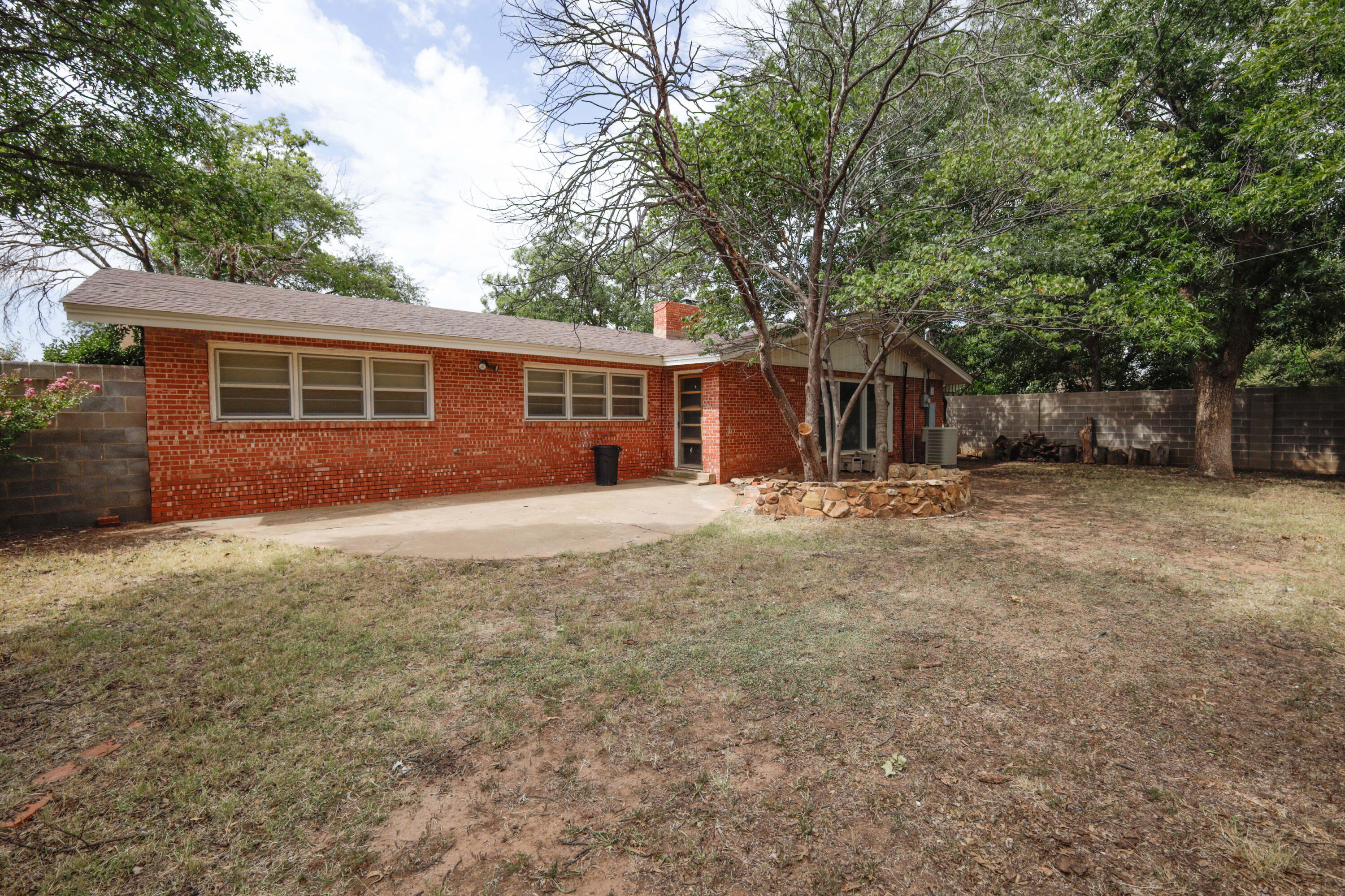 3202 45th Street Lubbock, TX 79413 - Photo 22 of 23 front view of a house with a yard