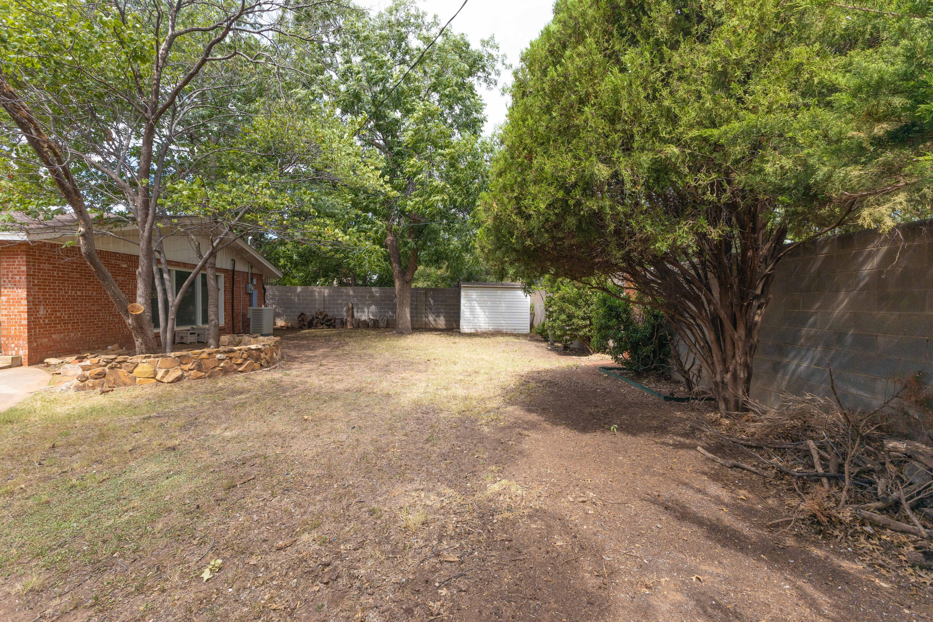 3202 45th Street Lubbock, TX 79413 - Photo 23 of 23 a view of a house with a yard and tree
