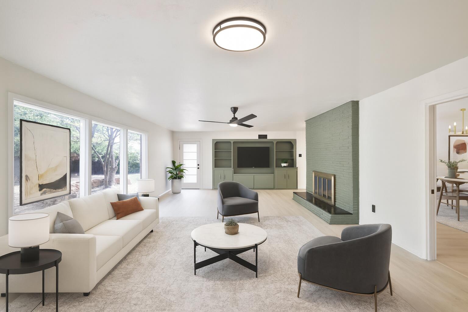 3202 45th Street Lubbock, TX 79413 - Photo 10 of 23 a living room with furniture a fireplace and a large window