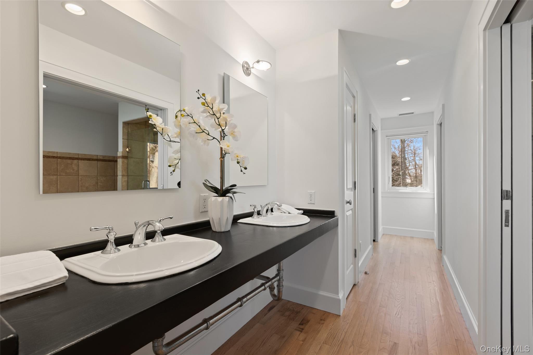 4 Trails End Rye, NY 10580 - Photo 27 of 44 a bathroom with a sink and a mirror