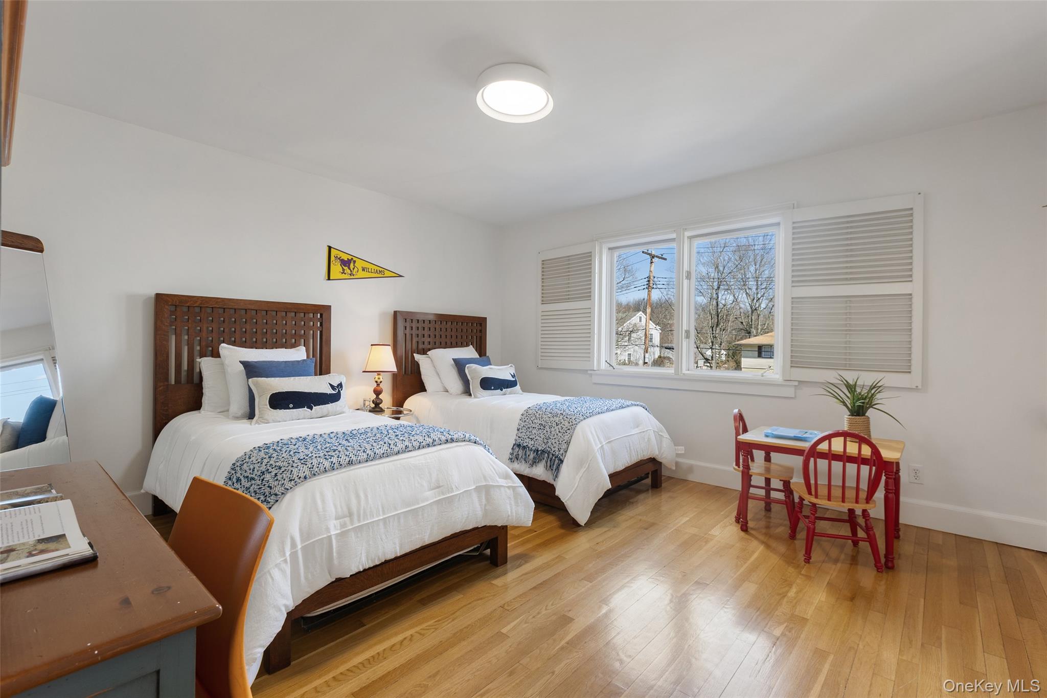 4 Trails End Rye, NY 10580 - Photo 28 of 44 a bedroom with two beds and a large window