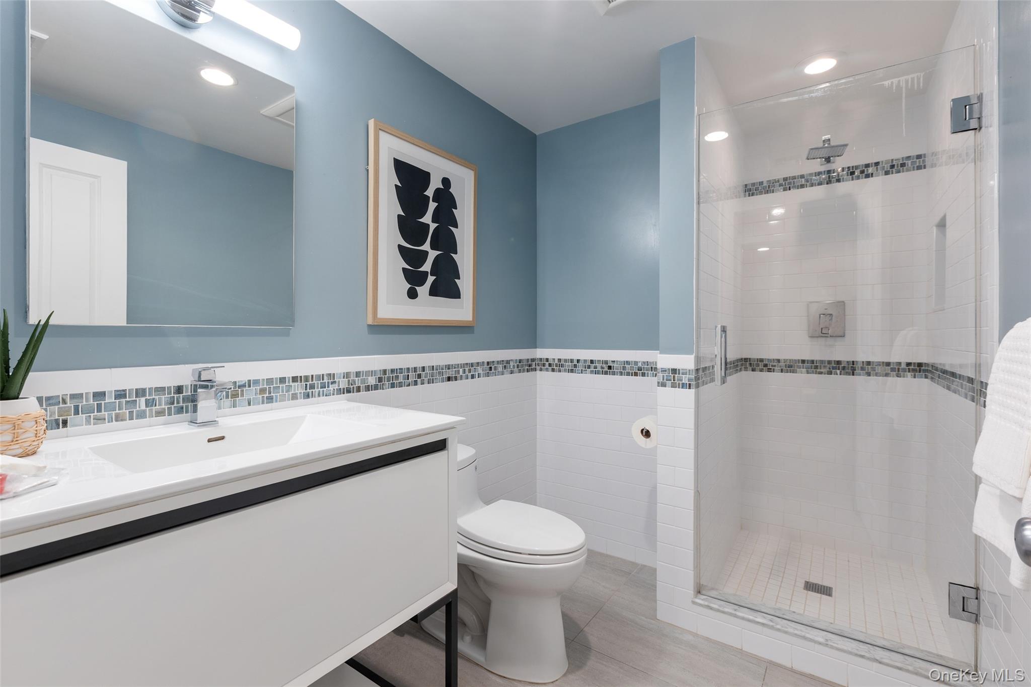 4 Trails End Rye, NY 10580 - Photo 29 of 44 a bathroom with a sink toilet and shower