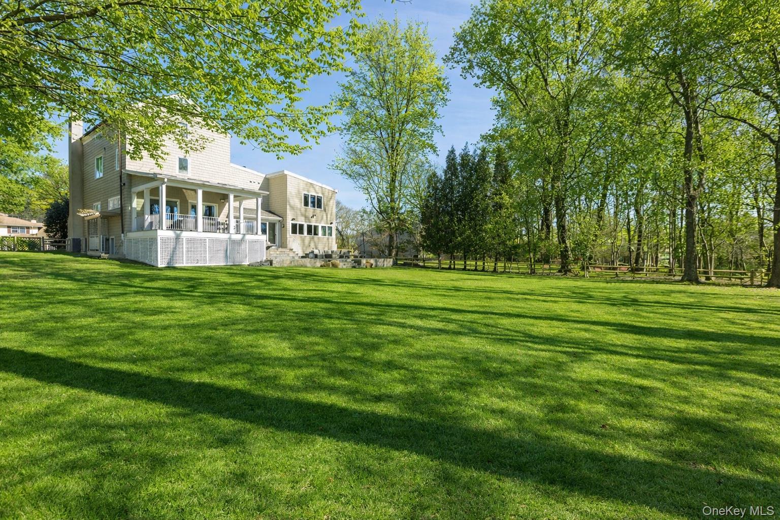 4 Trails End Rye, NY 10580 - Photo 3 of 44 a view of a house with a big yard and large trees