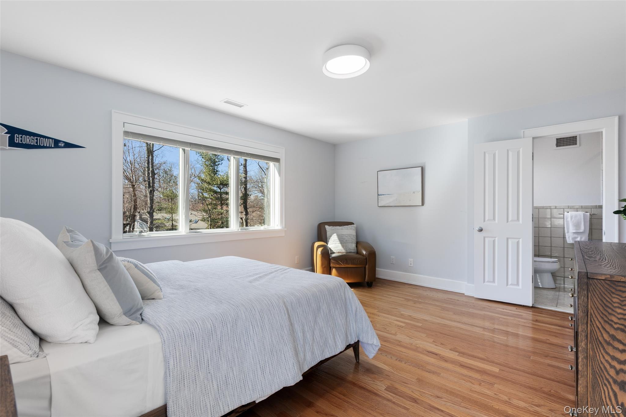 4 Trails End Rye, NY 10580 - Photo 32 of 44 a bedroom with a bed and a large window