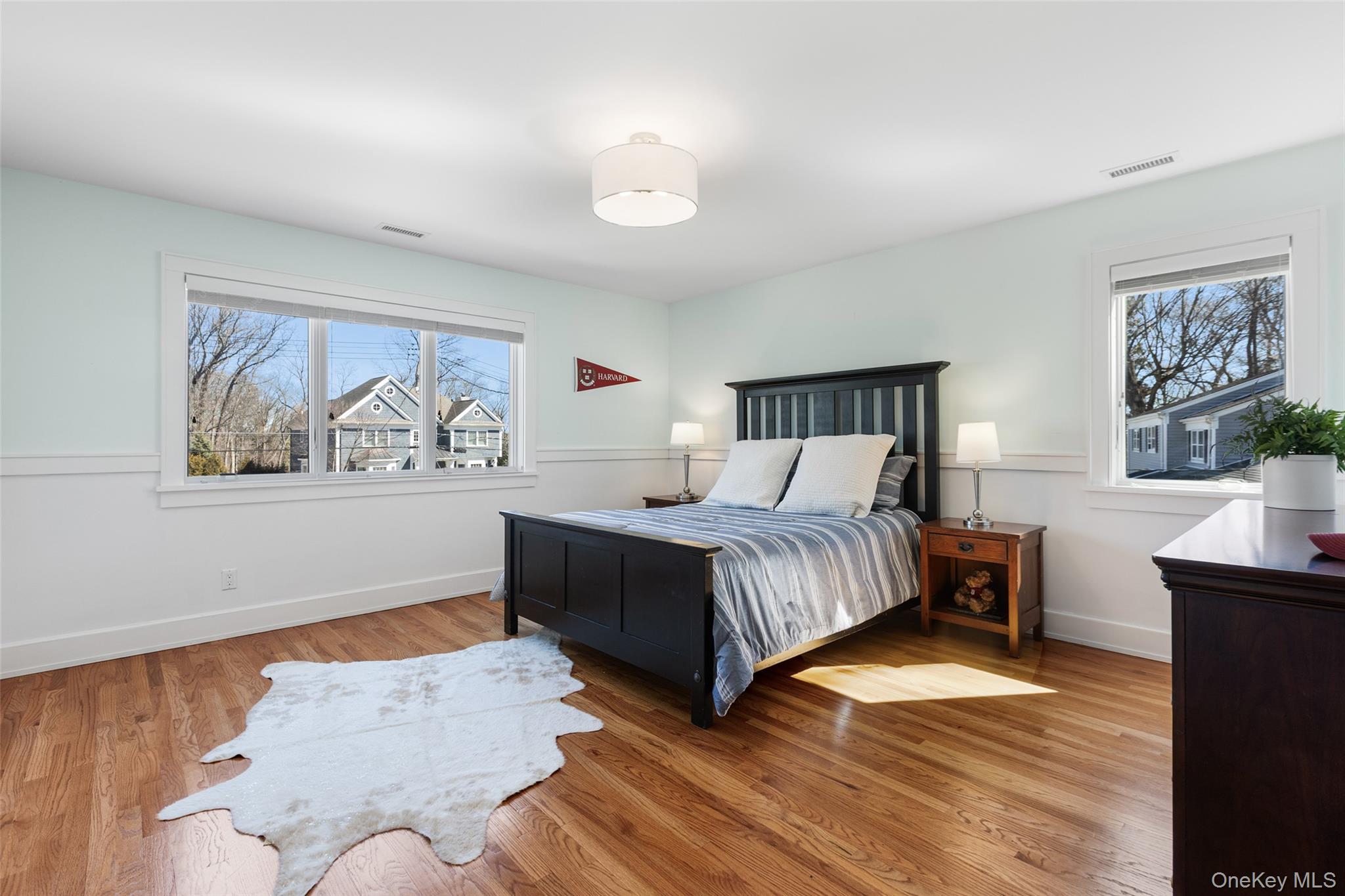 4 Trails End Rye, NY 10580 - Photo 33 of 44 a bedroom with a bed and a painting on the wall