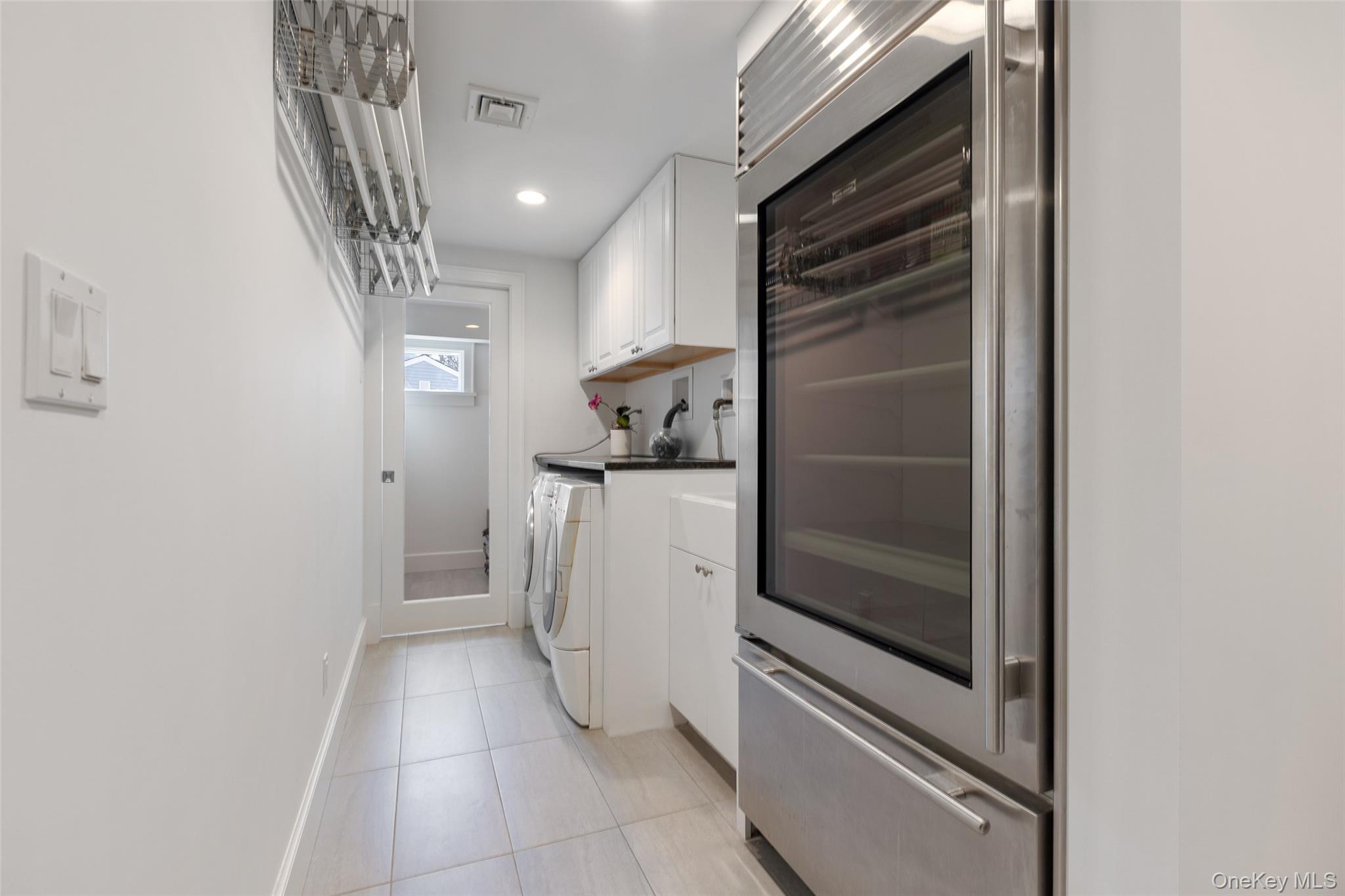 4 Trails End Rye, NY 10580 - Photo 34 of 44 a kitchen with a refrigerator and white cabinets