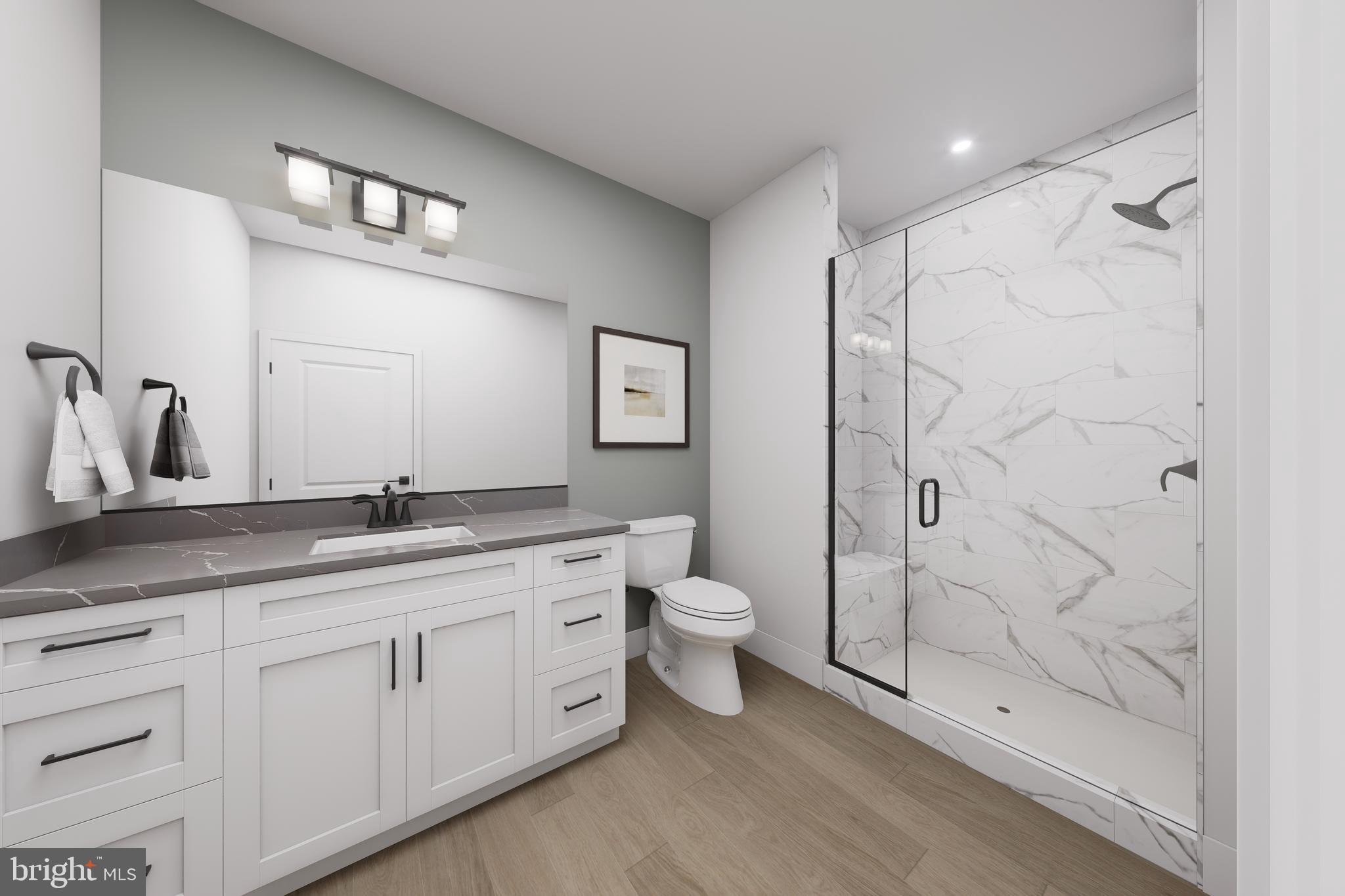 1121 Fortune Terrace, Unit 7 Potomac, MD 20854 - Photo 8 of 10 a bathroom with a double vanity sink toilet and shower