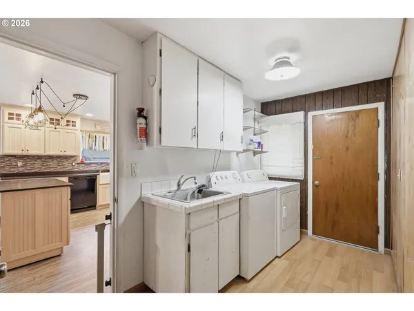 a kitchen with a sink stove and refrigerator