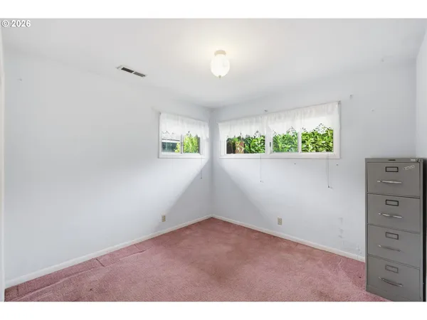 view of an empty room with a window