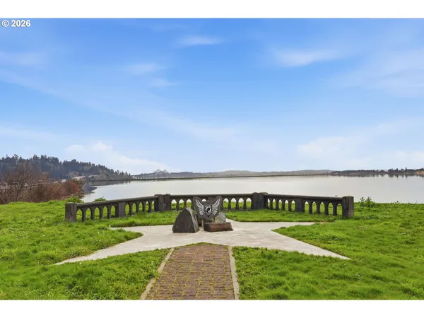 a view of swimming pool with a garden and mountain view
