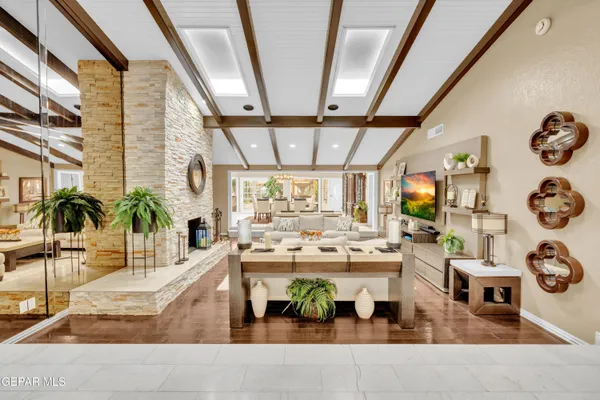 a kitchen with stainless steel appliances granite countertop a lot of counter space and wooden floors