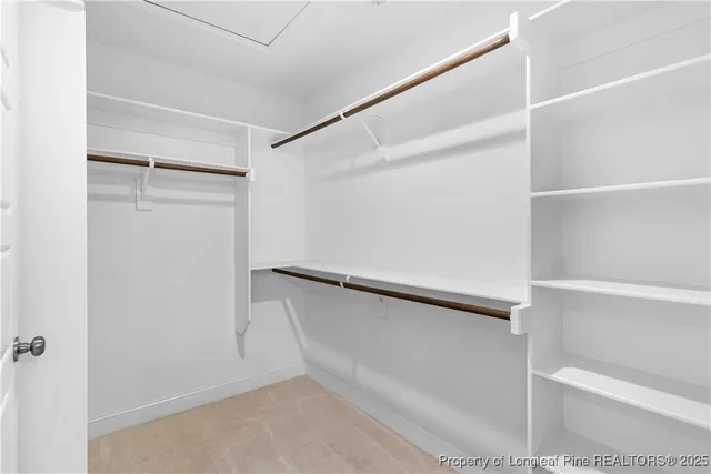 a view of an empty walk in closet