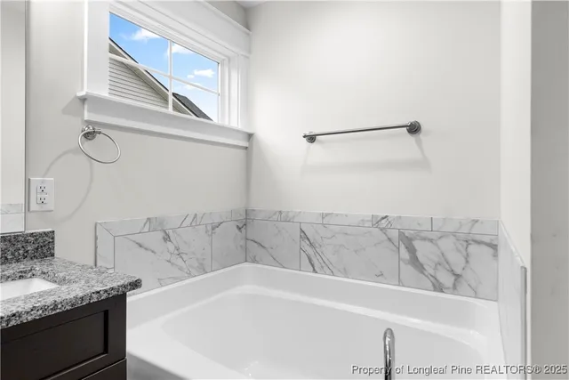 a bathroom with a bathtub and a sink