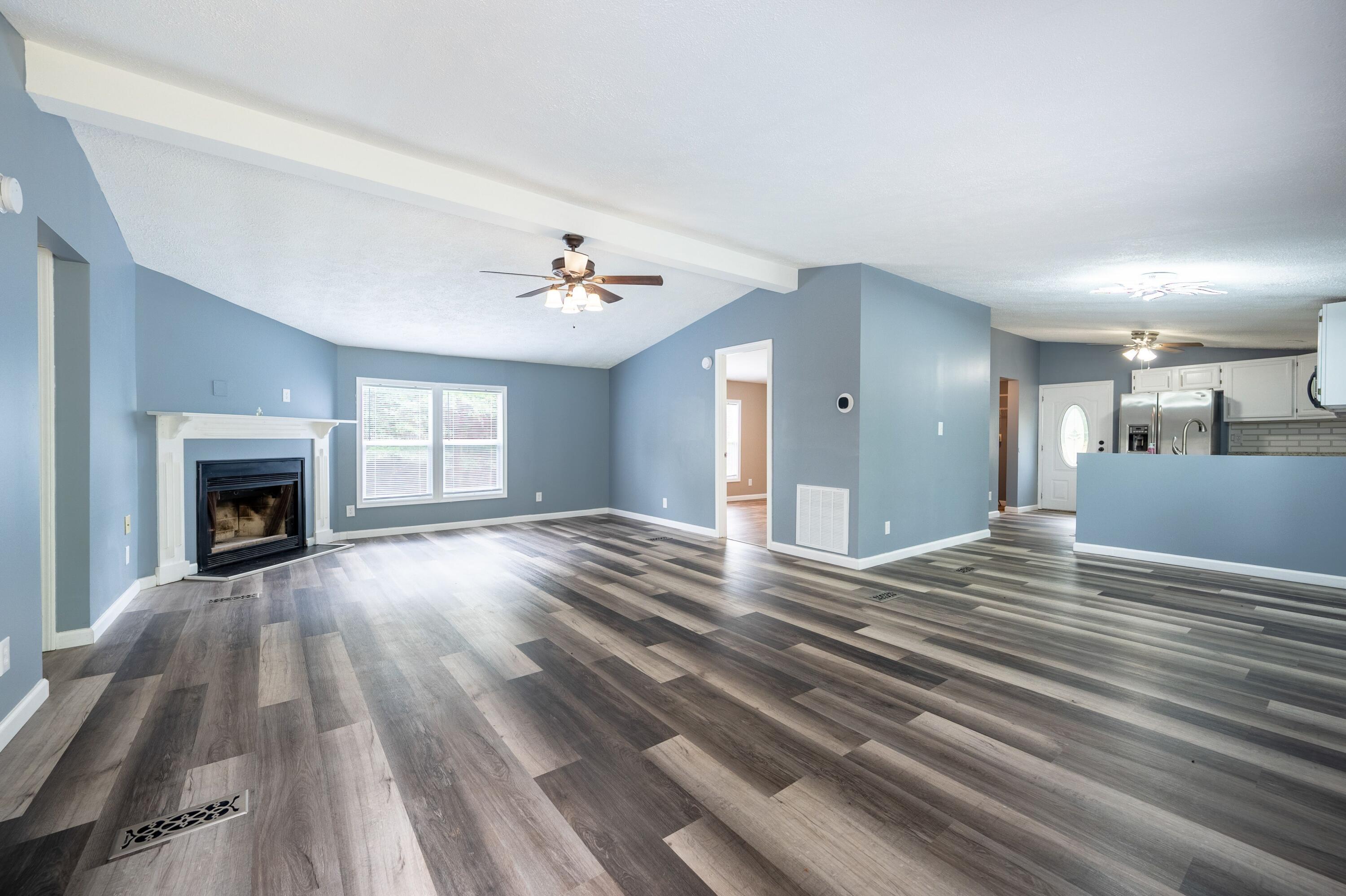 4342 County Line Road Patrick Springs, VA 24133 - Photo 13 of 34 a view of empty room with wooden floor and fireplace
