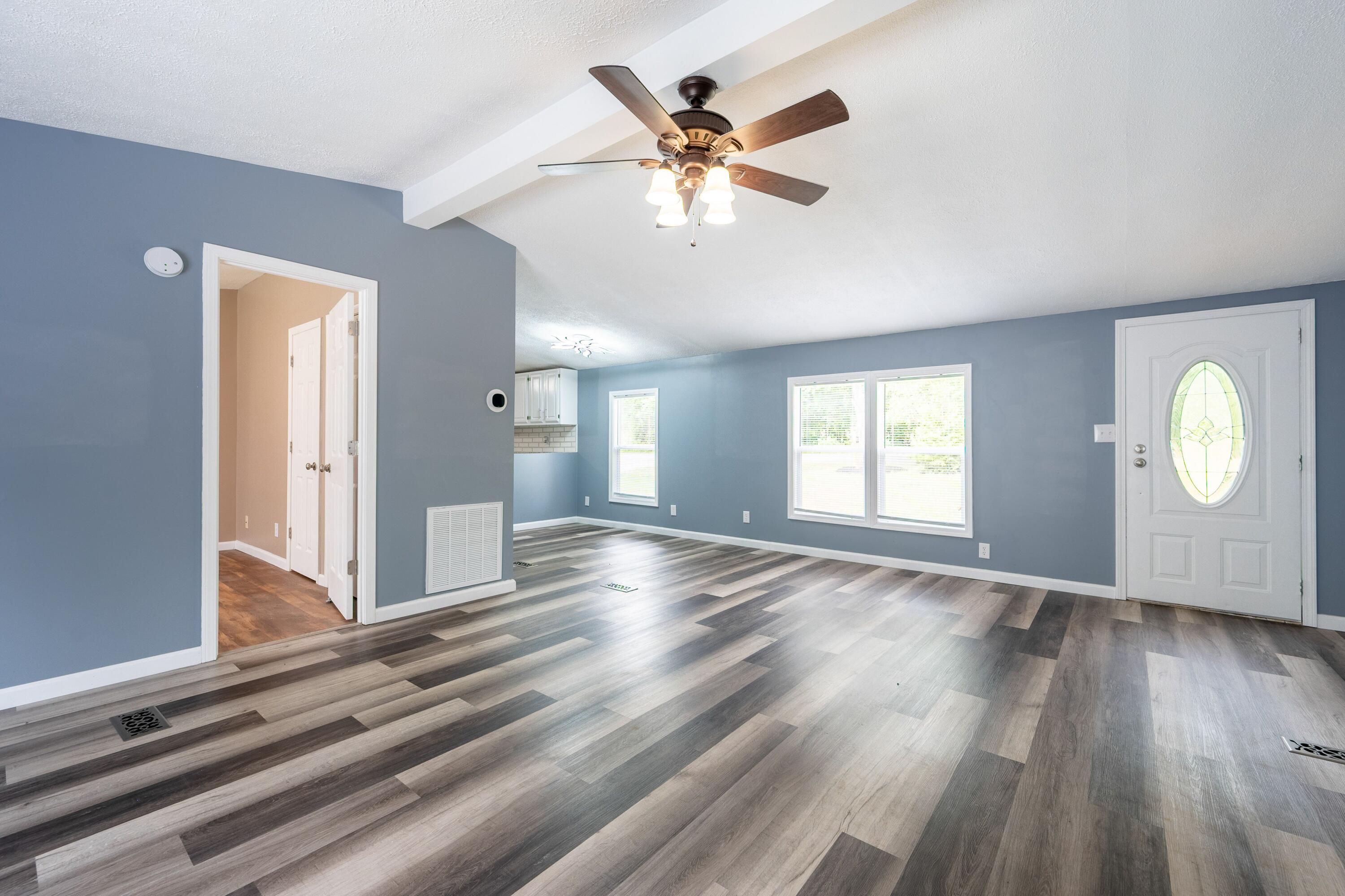4342 County Line Road Patrick Springs, VA 24133 - Photo 15 of 34 a view of an empty room with wooden floor and a window