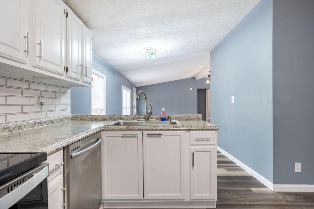 4342 County Line Road Patrick Springs, VA 24133 - Photo 20 of 34 a kitchen with a sink and cabinets