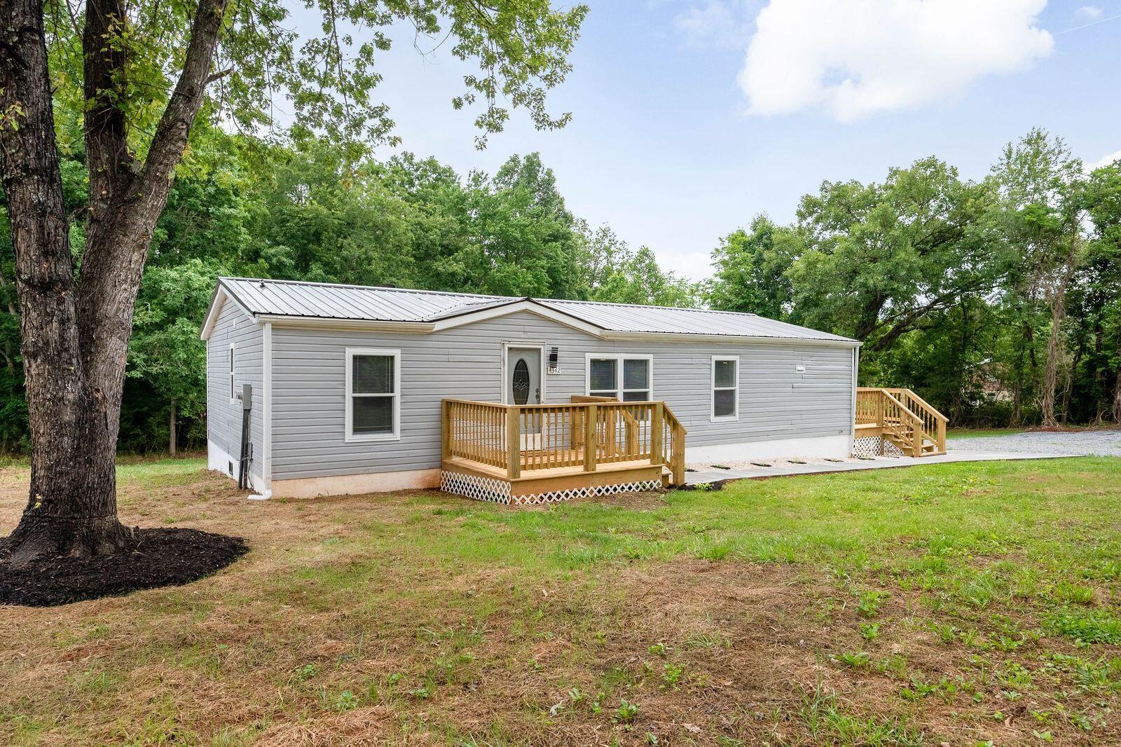 4342 County Line Road Patrick Springs, VA 24133 - Photo 2 of 34 a view of a house with a yard