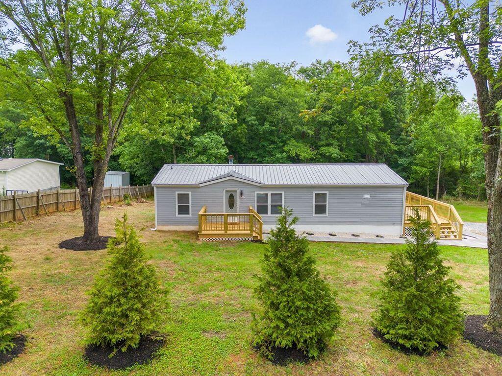 4342 County Line Road Patrick Springs, VA 24133 - Photo 31 of 34 a house view with a garden space
