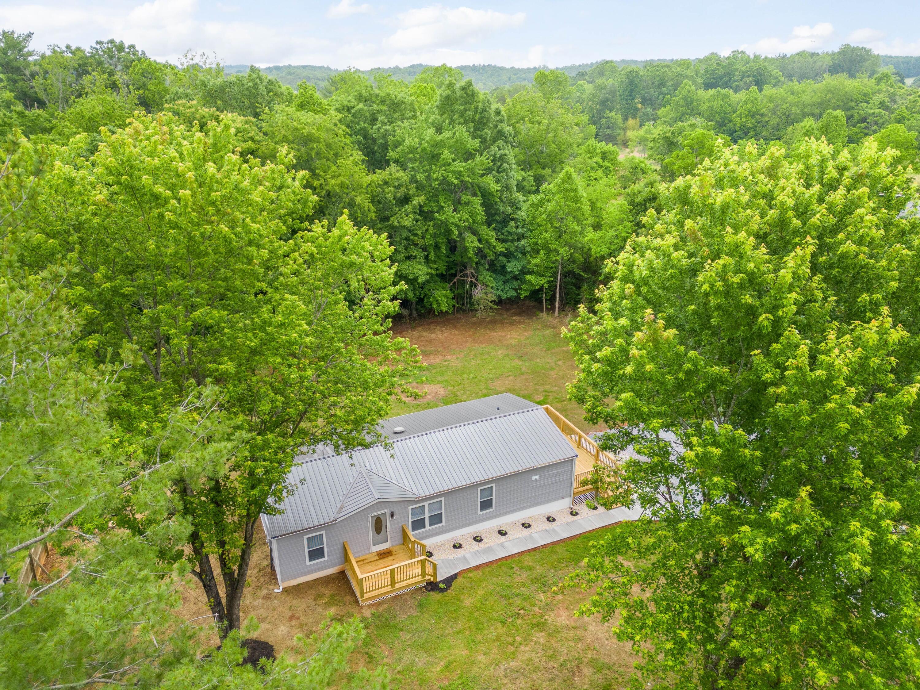 4342 County Line Road Patrick Springs, VA 24133 - Photo 32 of 34 an aerial view of a house with yard