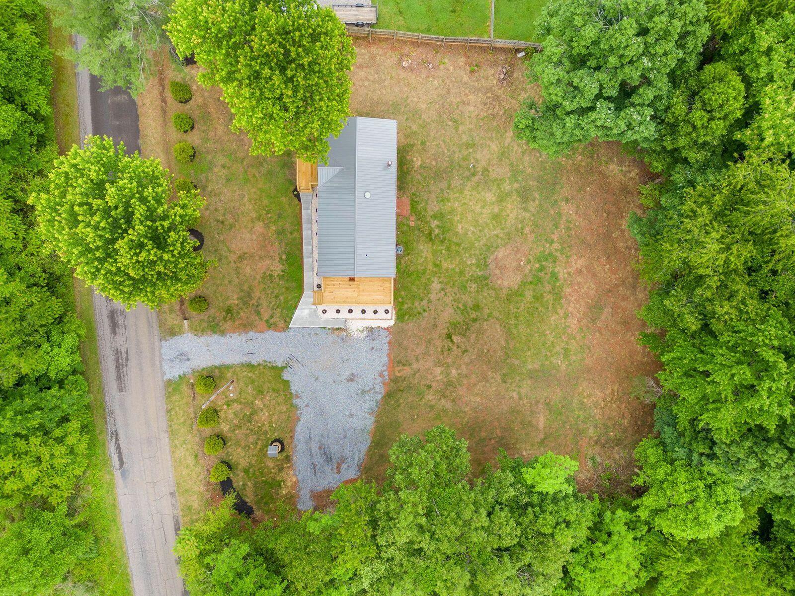 4342 County Line Road Patrick Springs, VA 24133 - Photo 33 of 34 aerial view of a house with a trees