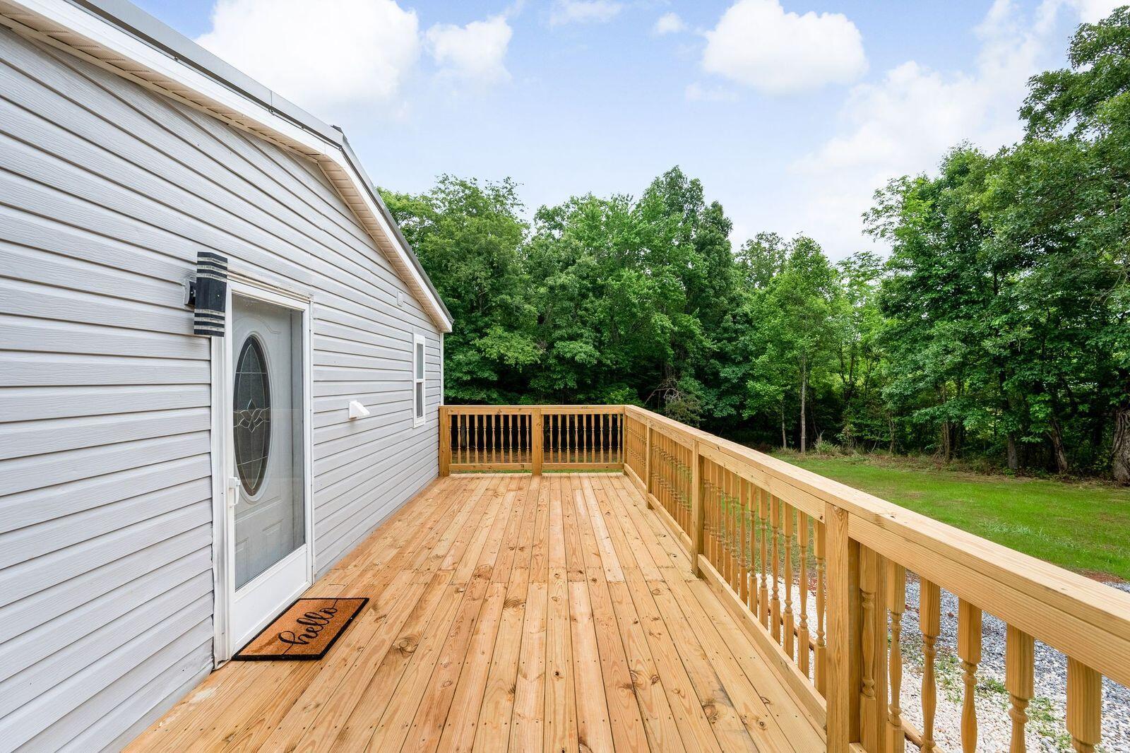 4342 County Line Road Patrick Springs, VA 24133 - Photo 6 of 34 a view of a balcony with wooden floor and fence