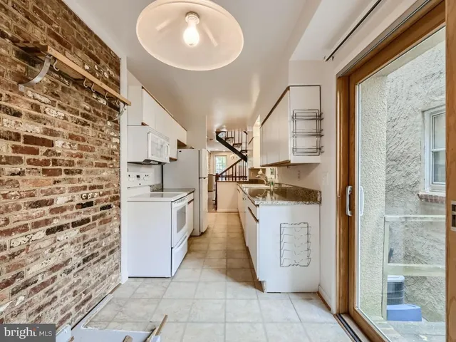 a view of entryway with wooden floor and stairs
