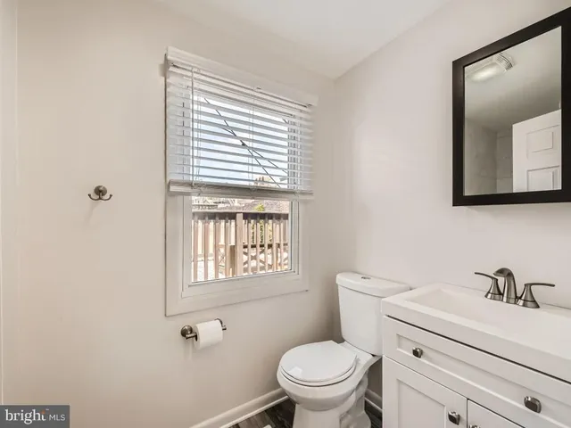 a view of an empty room and wooden floor