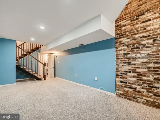 a bathroom with a sink a mirror and shower curtain