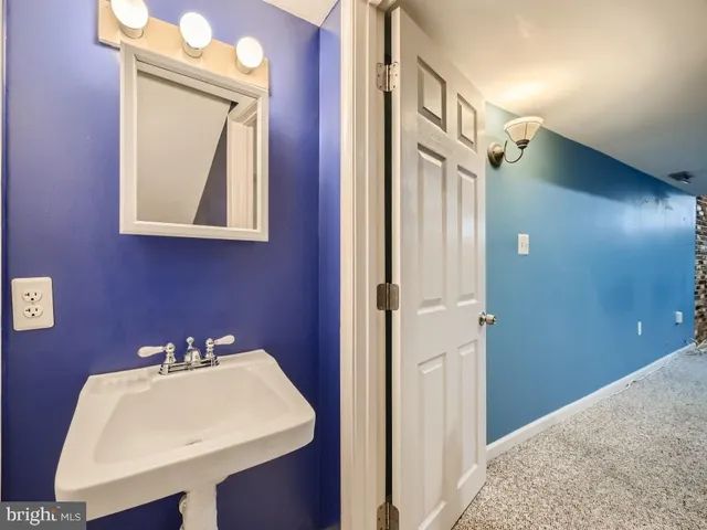a view of an entryway with wooden floor and staircase