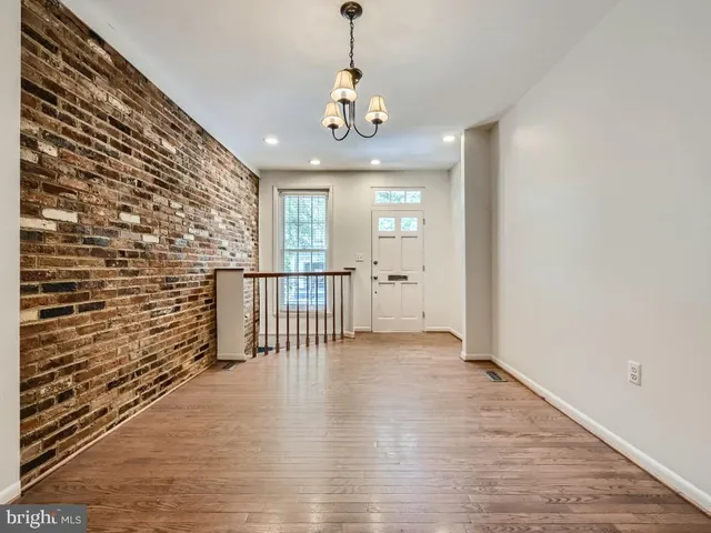a view of entryway with wooden floor
