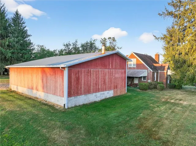 a view of a back yard of the house