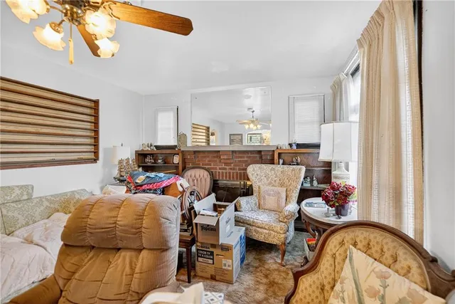 a dining room with furniture a chandelier and wooden floor