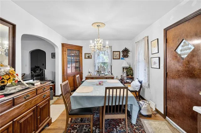 a large kitchen with lots of counter top space and dining table