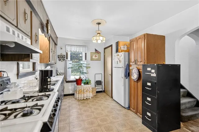 a utility room with sink dryer and washer