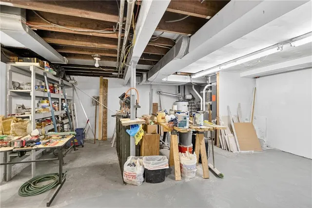 a bed room with a bed and a window