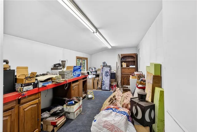 a view of a workspace with furniture