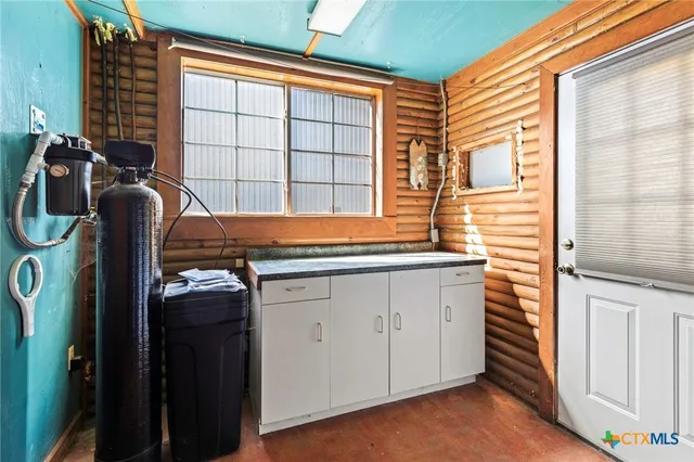 a bathroom with a sink and a window