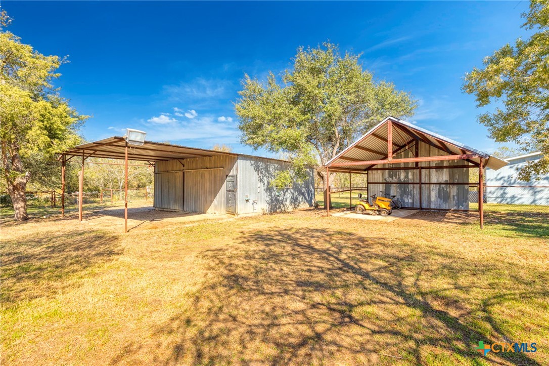55 County Line Road Dale, TX 78616 - Photo 4 of 42 30 ft x 25 ft workshop and a 20 ft x 20 ft carport