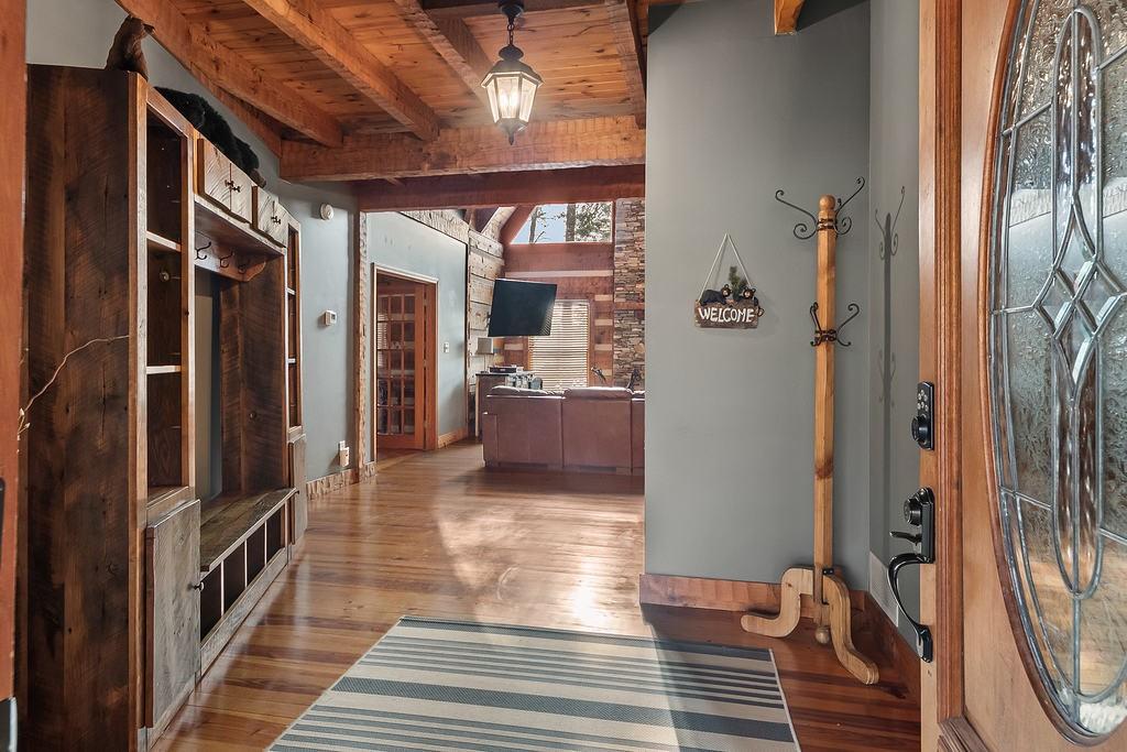192 Grassy Knob Court Jasper, GA 30143 - Photo 12 of 88 a view of a hallway with wooden floor and staircase